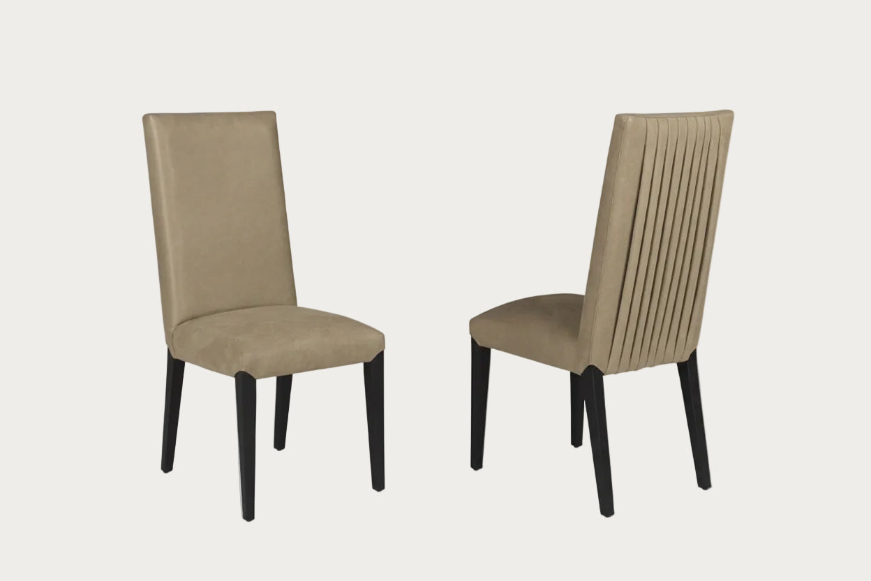 Two beige Westin dining chairs with black legs on a white background