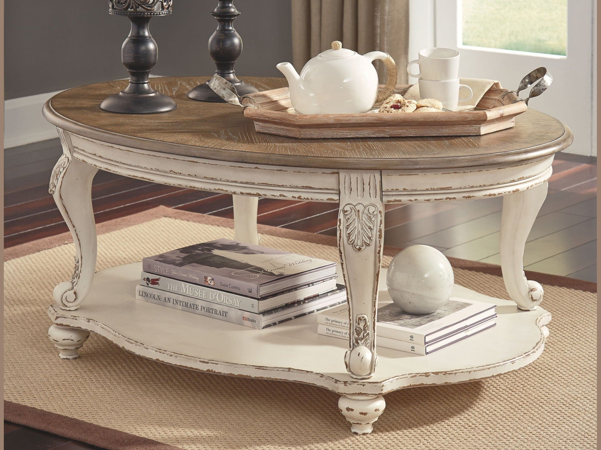 Realyn - Oval Cocktail Table - White / Brown