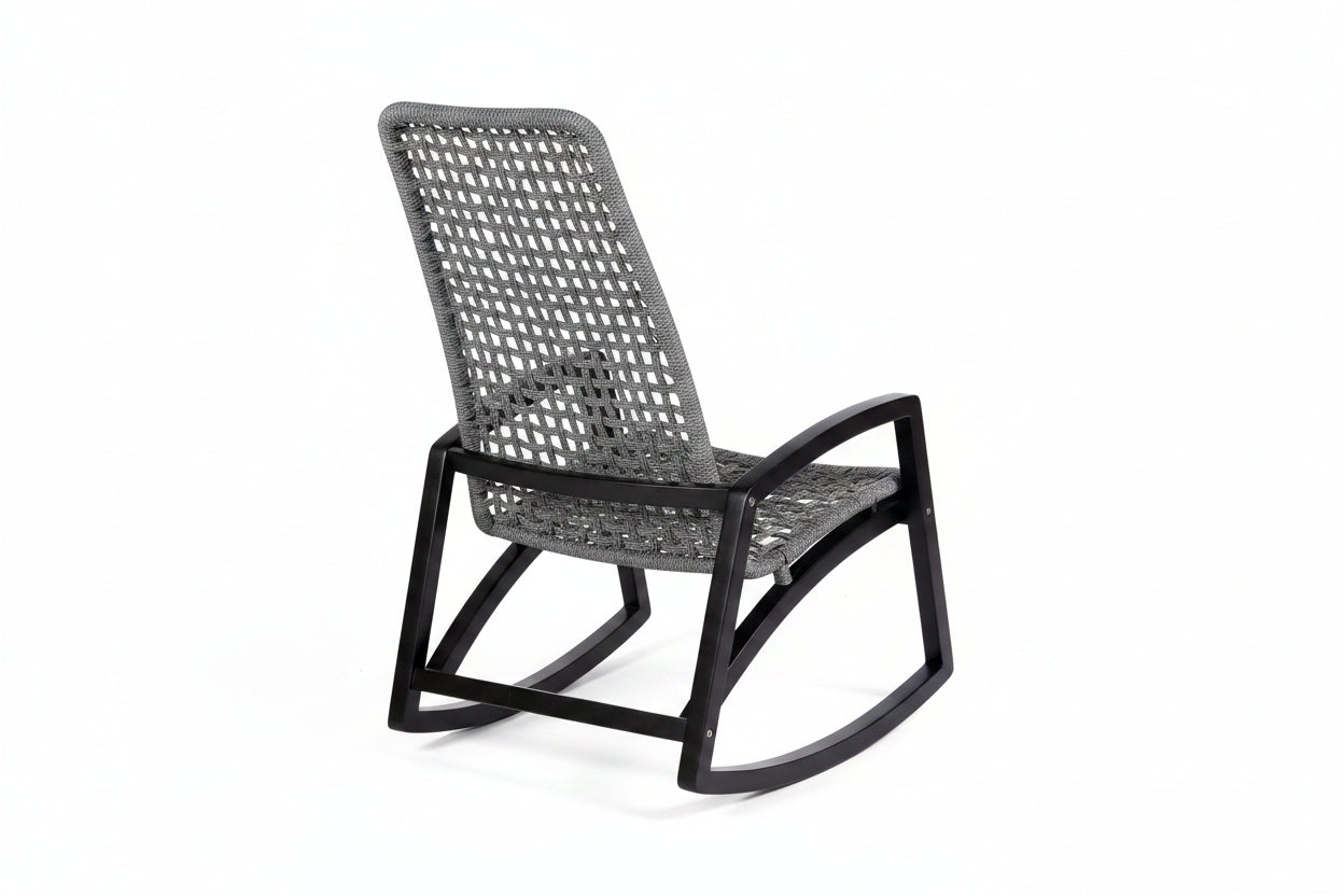 Rattan rocking chair with black frame on a white background
