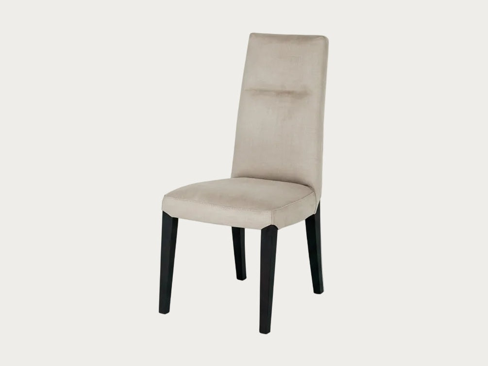 Cloe beige dining chair with black legs on a white background.