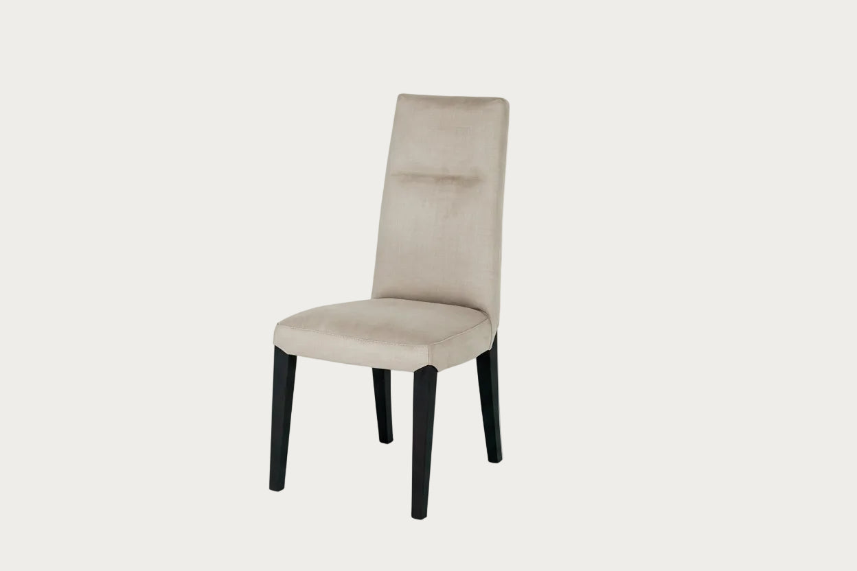 Cloe beige dining chair with black legs on a white background.