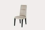 Cloe beige dining chair with black legs on a white background.