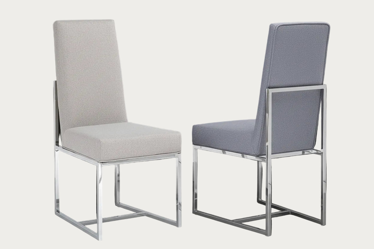 Two Bess chairs with metal frames on a dark background
