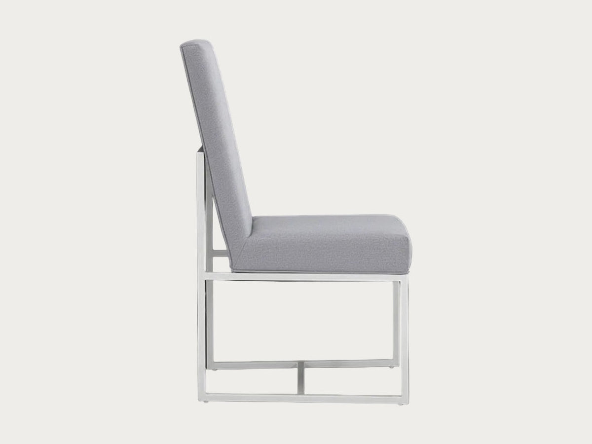 Bess gray fabric upholstered chair with a metal frame on a dark background.