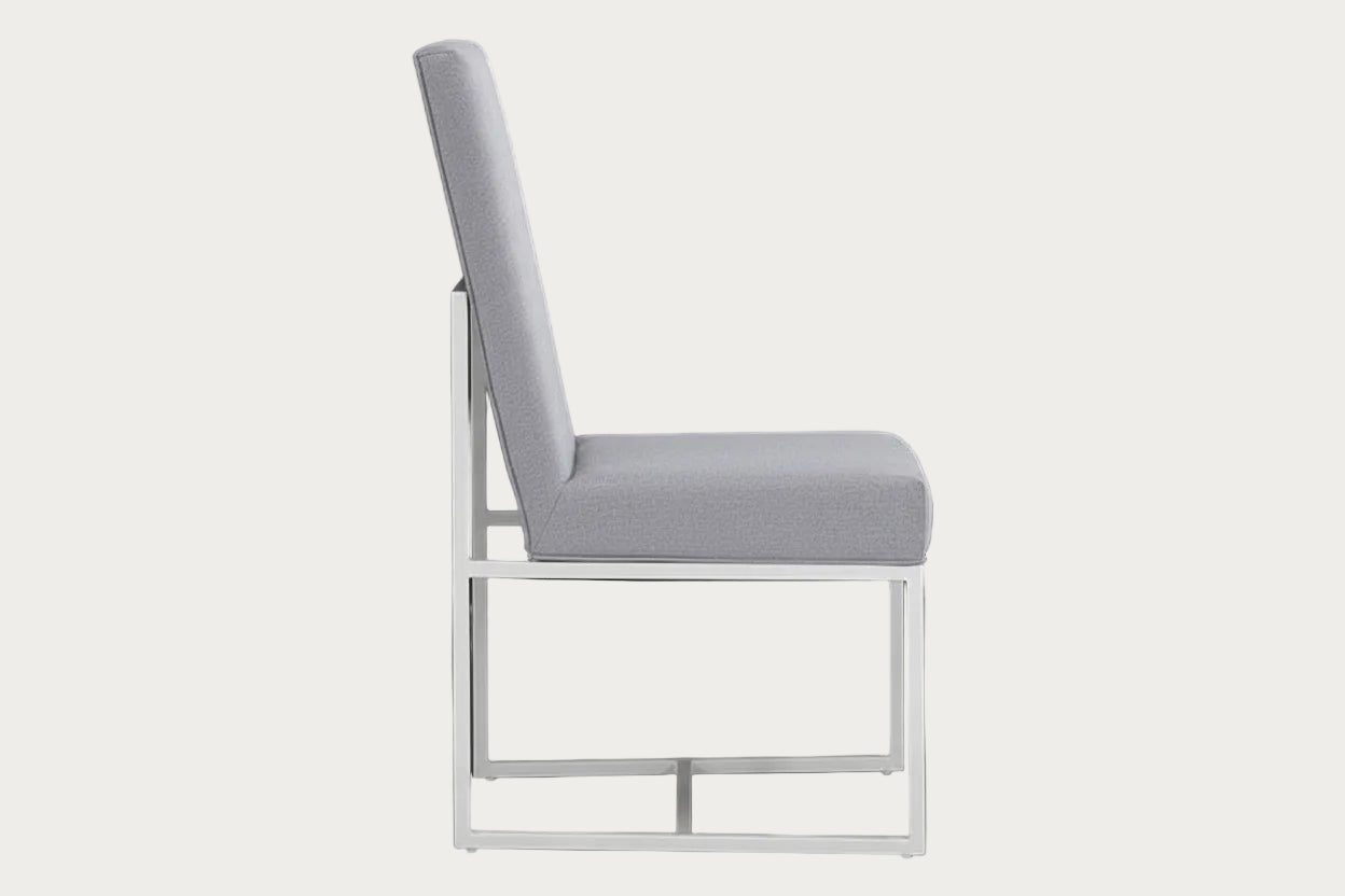 Bess gray fabric upholstered chair with a metal frame on a dark background.