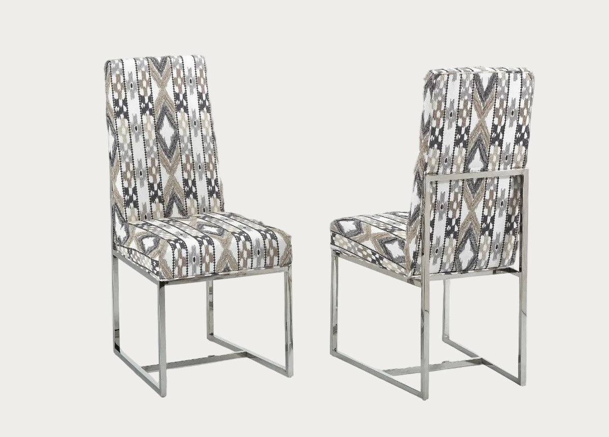 Two patterned Bess chairs on a white background