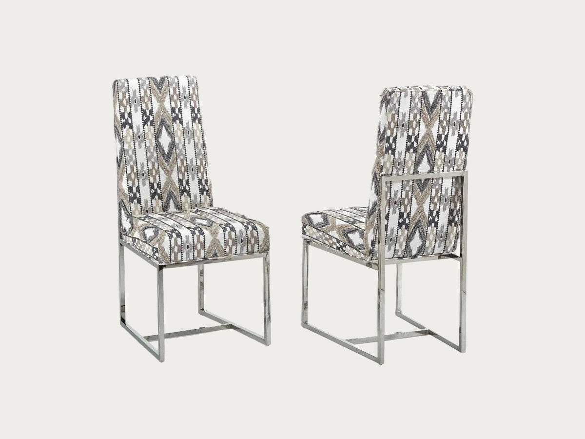 Two patterned Bess chairs on a white background