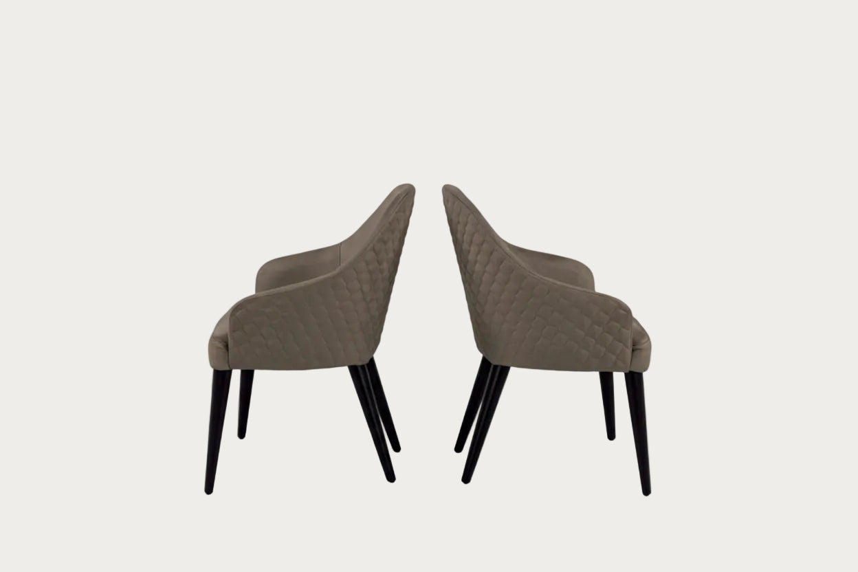 The Linda brown chairs with quilted design on a white background