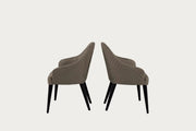 The Linda brown chairs with quilted design on a white background