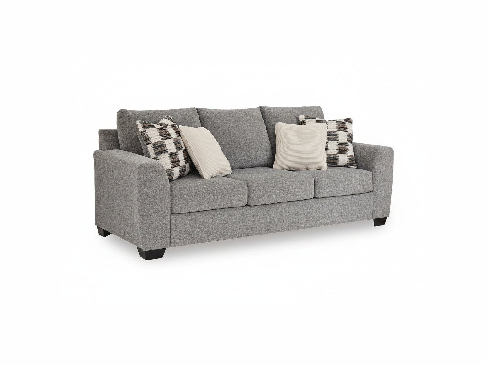Gray sofa with patterned and plain cushions on a white background