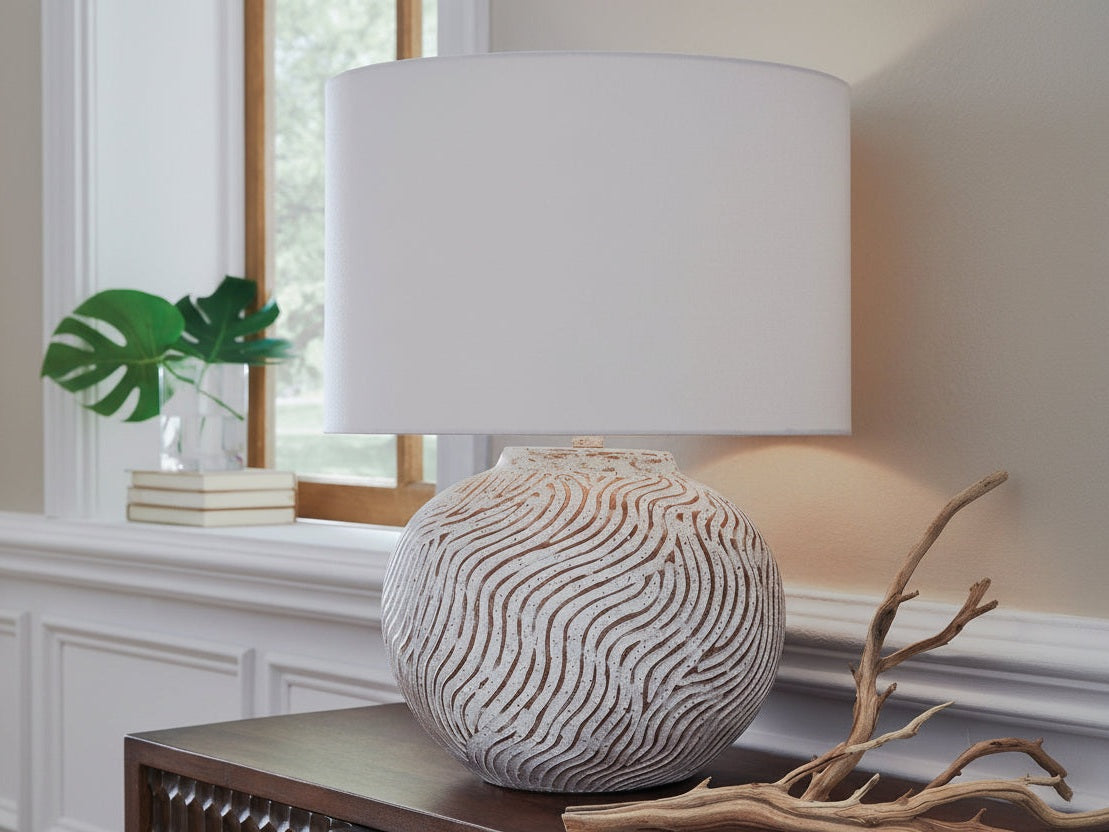 Vien decorative lamp with wavy pattern on a surface near a window