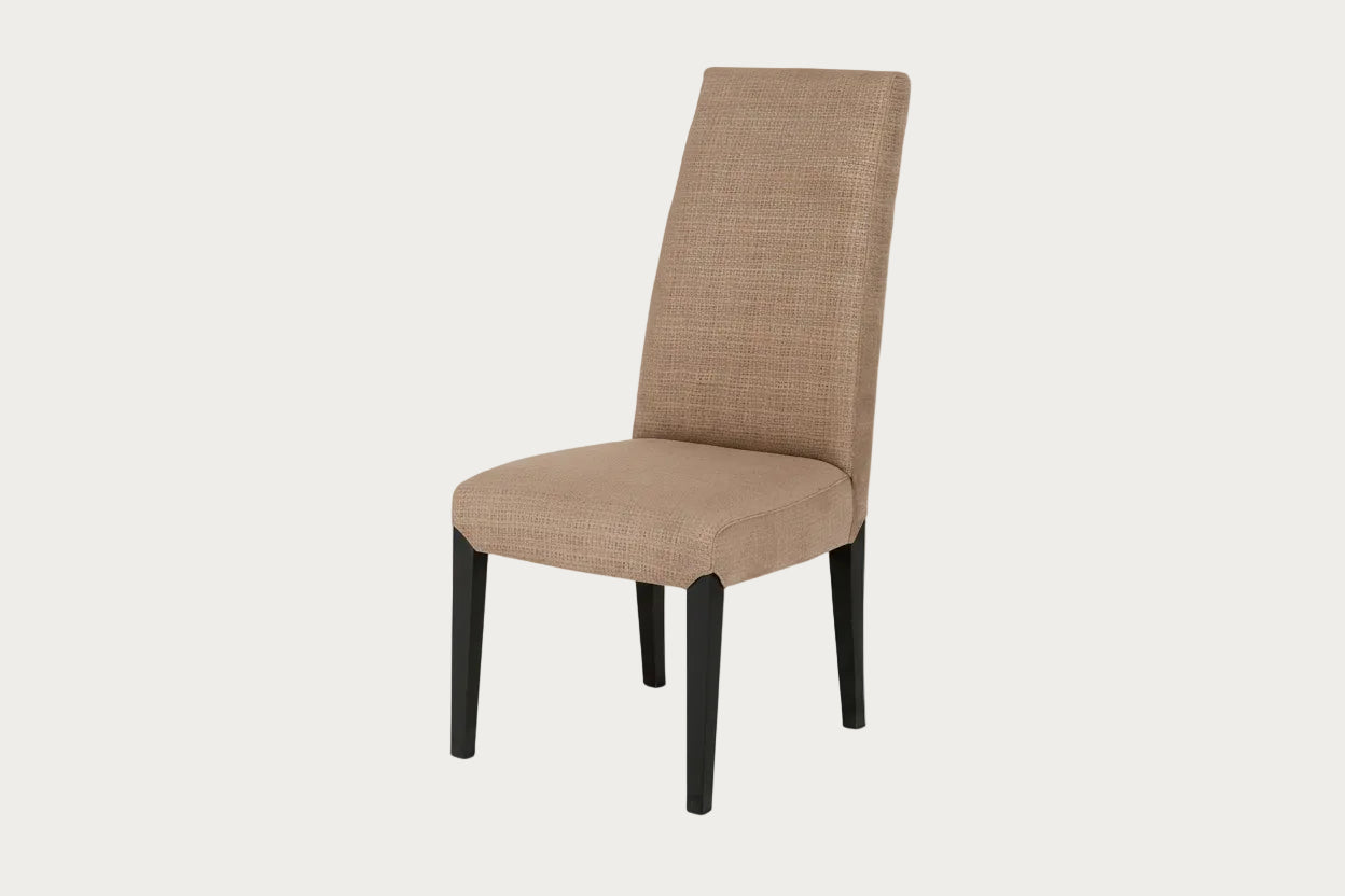 Juliette beige upholstered chair with black legs on a white background