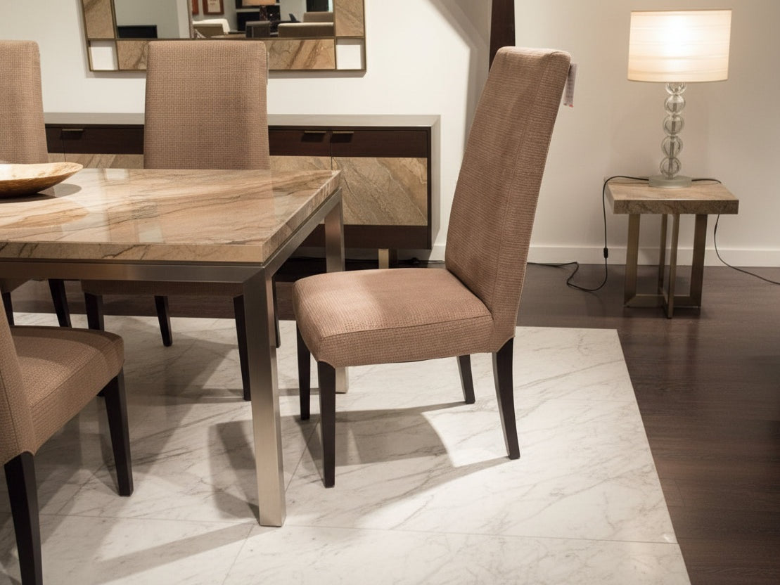Brown upholstered chair in a dining room setting with a table and chairs.