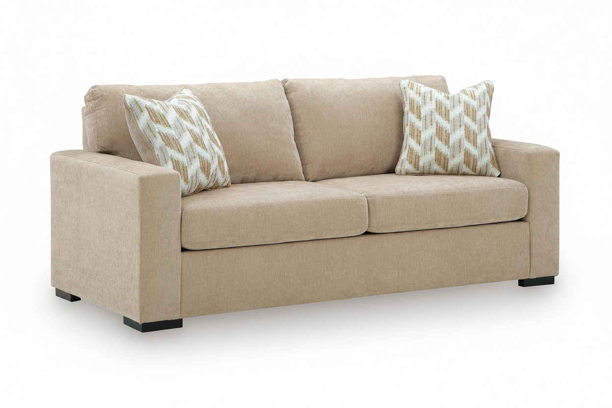 Beige sofa with patterned cushions on a white background