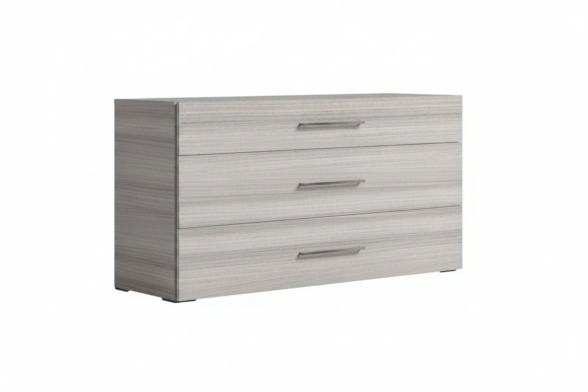 A three-drawer dresser with a light gray wood grain finish and slim horizontal metal handles, shown on a plain white background.