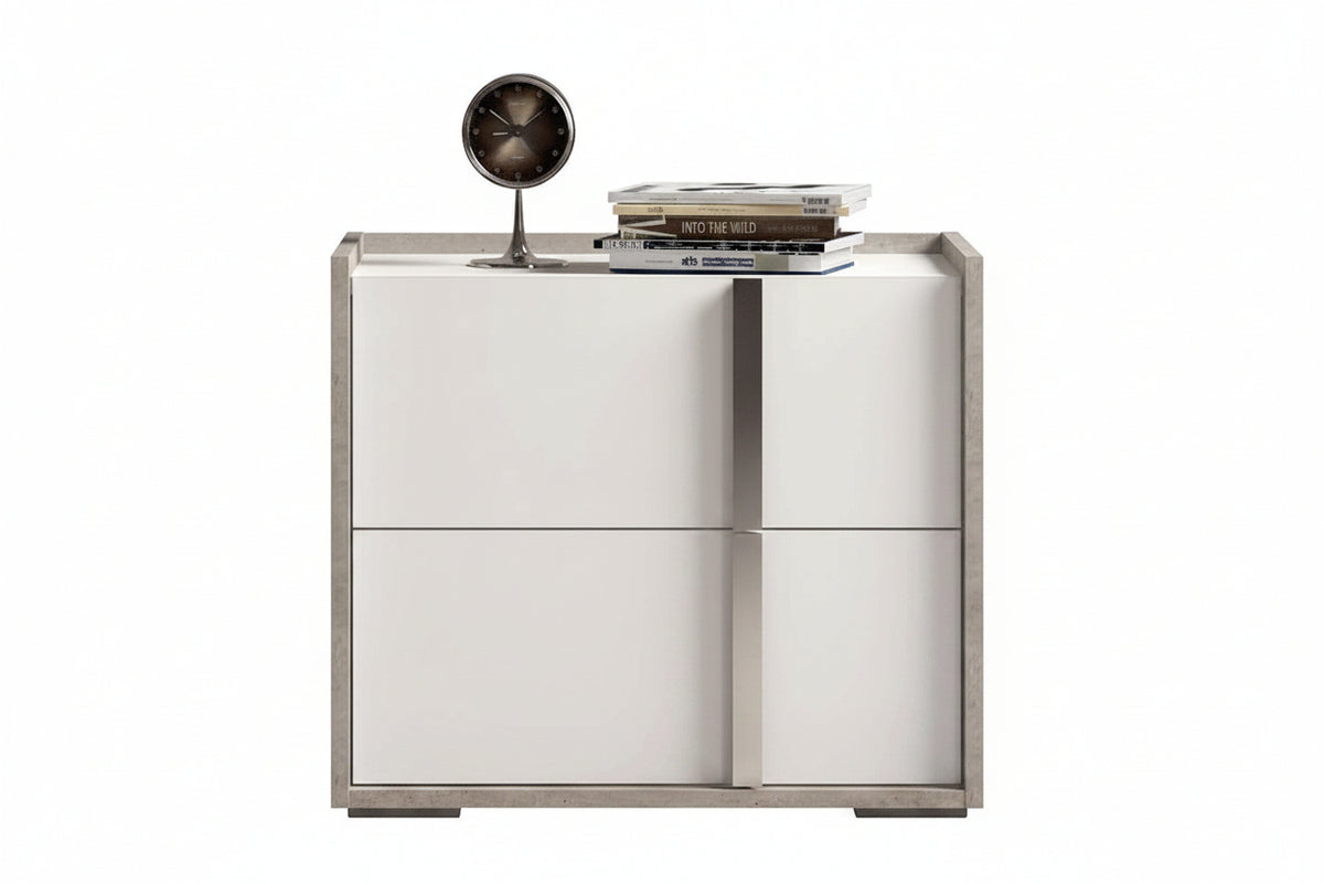 A modern two-door sideboard cabinet with a white high-gloss finish and a textured gray frame, styled with a small desk fan and books on top, set against a plain white background.