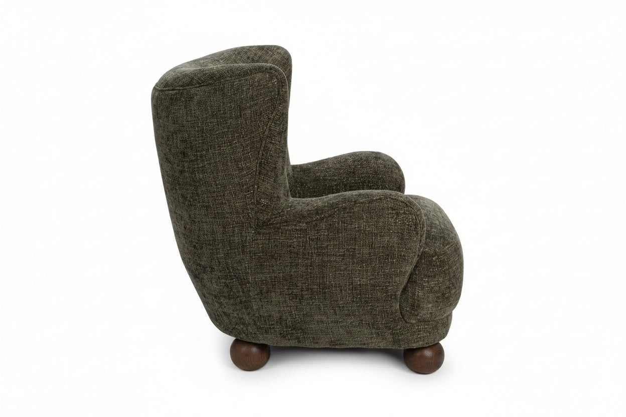 Brown upholstered armchair with wooden legs on a white background