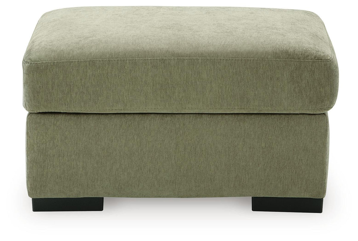 A square upholstered ottoman with a textured sage green fabric and black block feet, shown from a front-facing perspective on a white background.