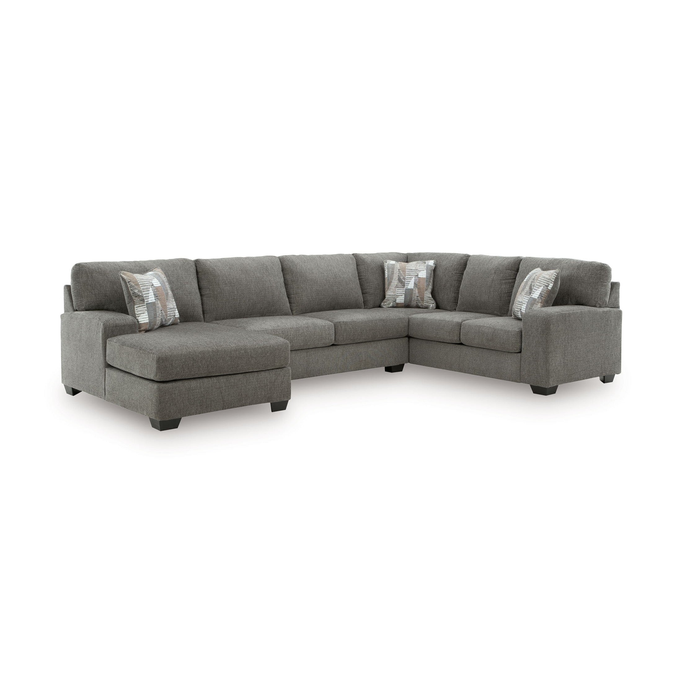 Gray sectional sofa with patterned cushions on a white background