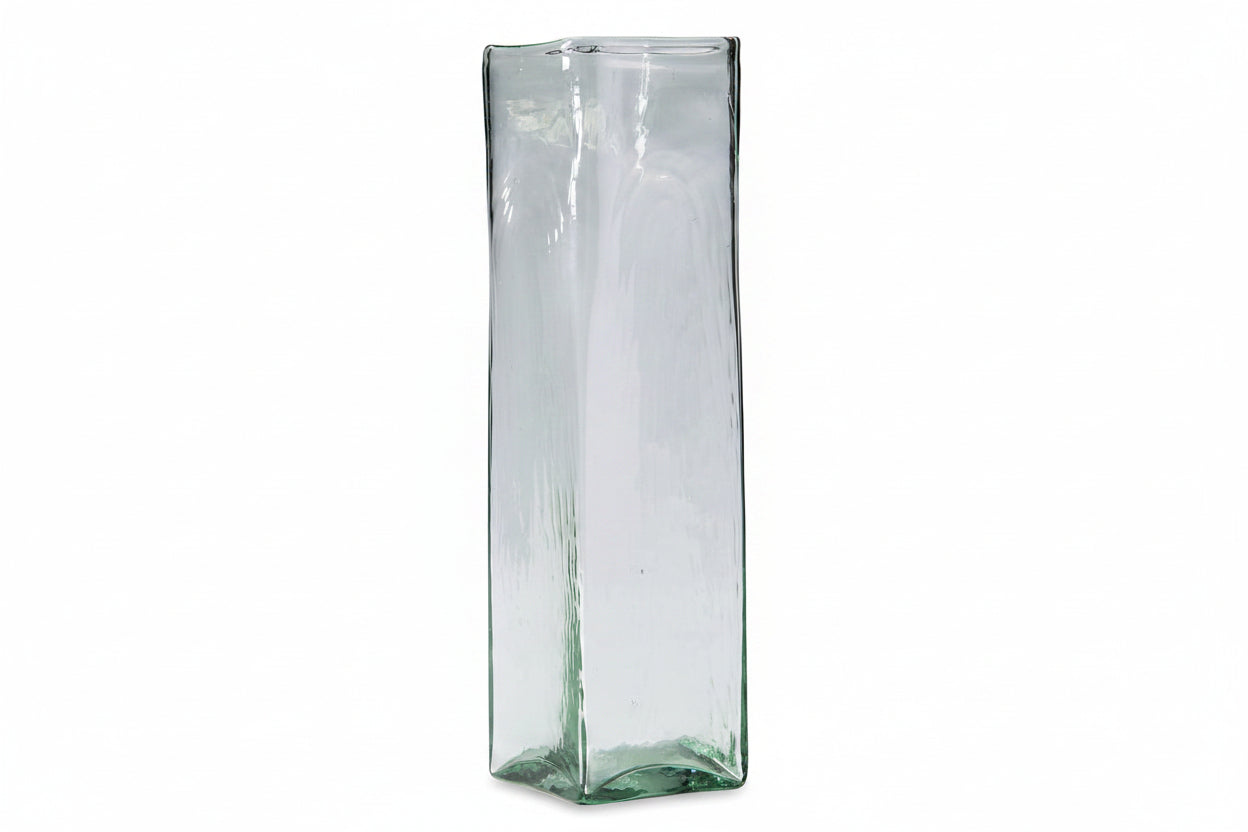 Tall, transparent glass vase with a textured surface