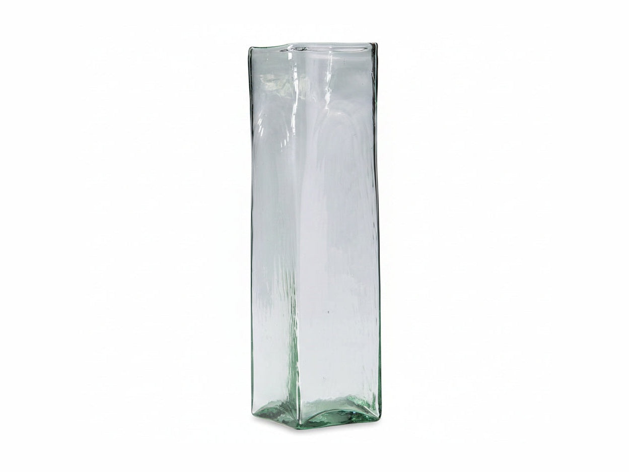Tall, transparent glass vase with a textured surface