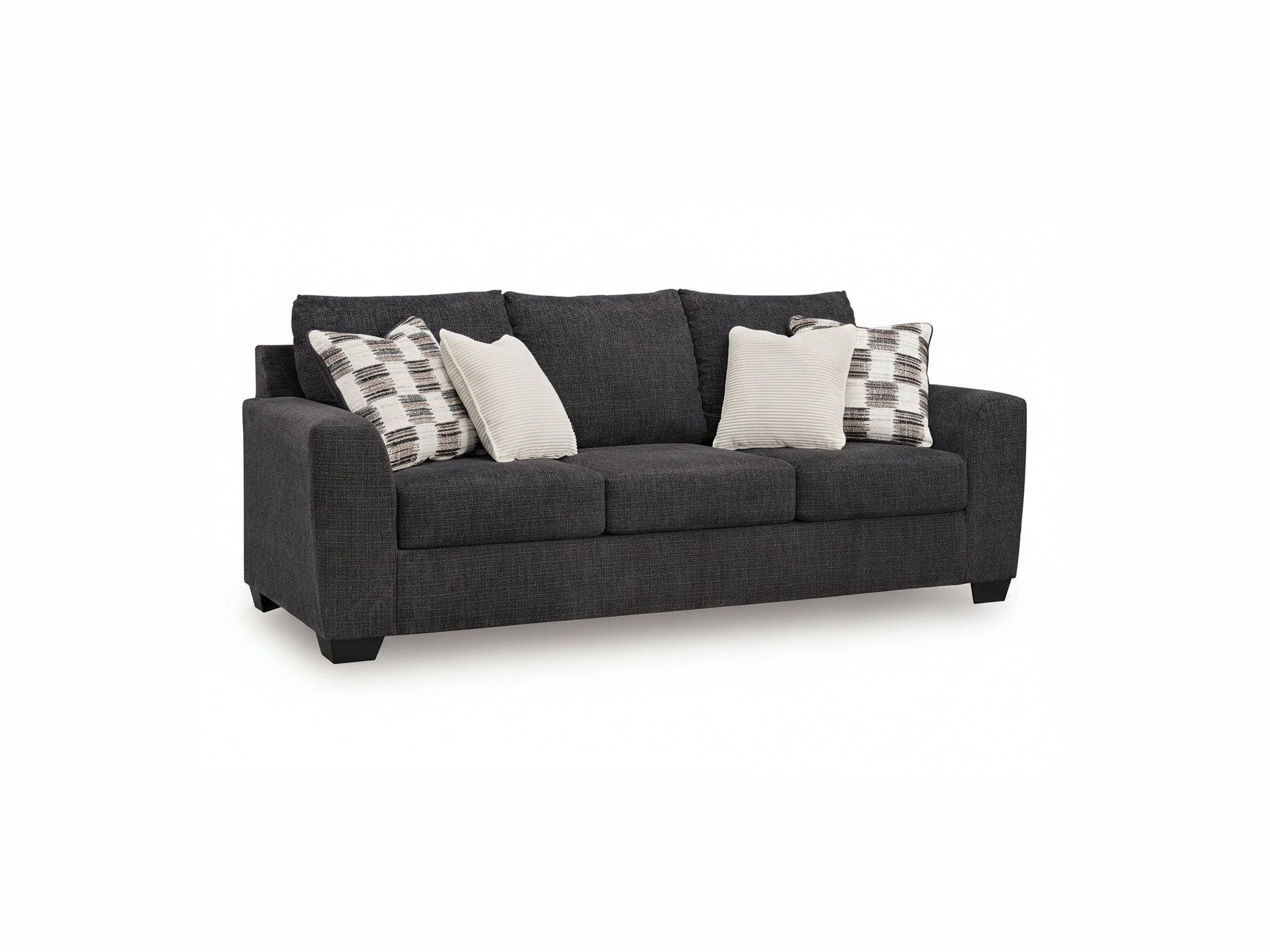 Gray sofa with patterned and plain cushions on a white background