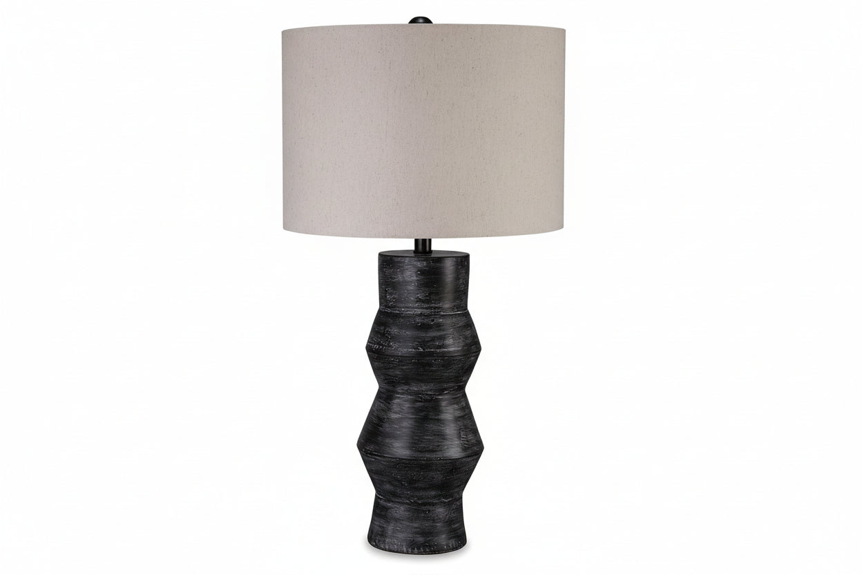 Kerbert table lamp with textured black base and beige lampshade on a white background