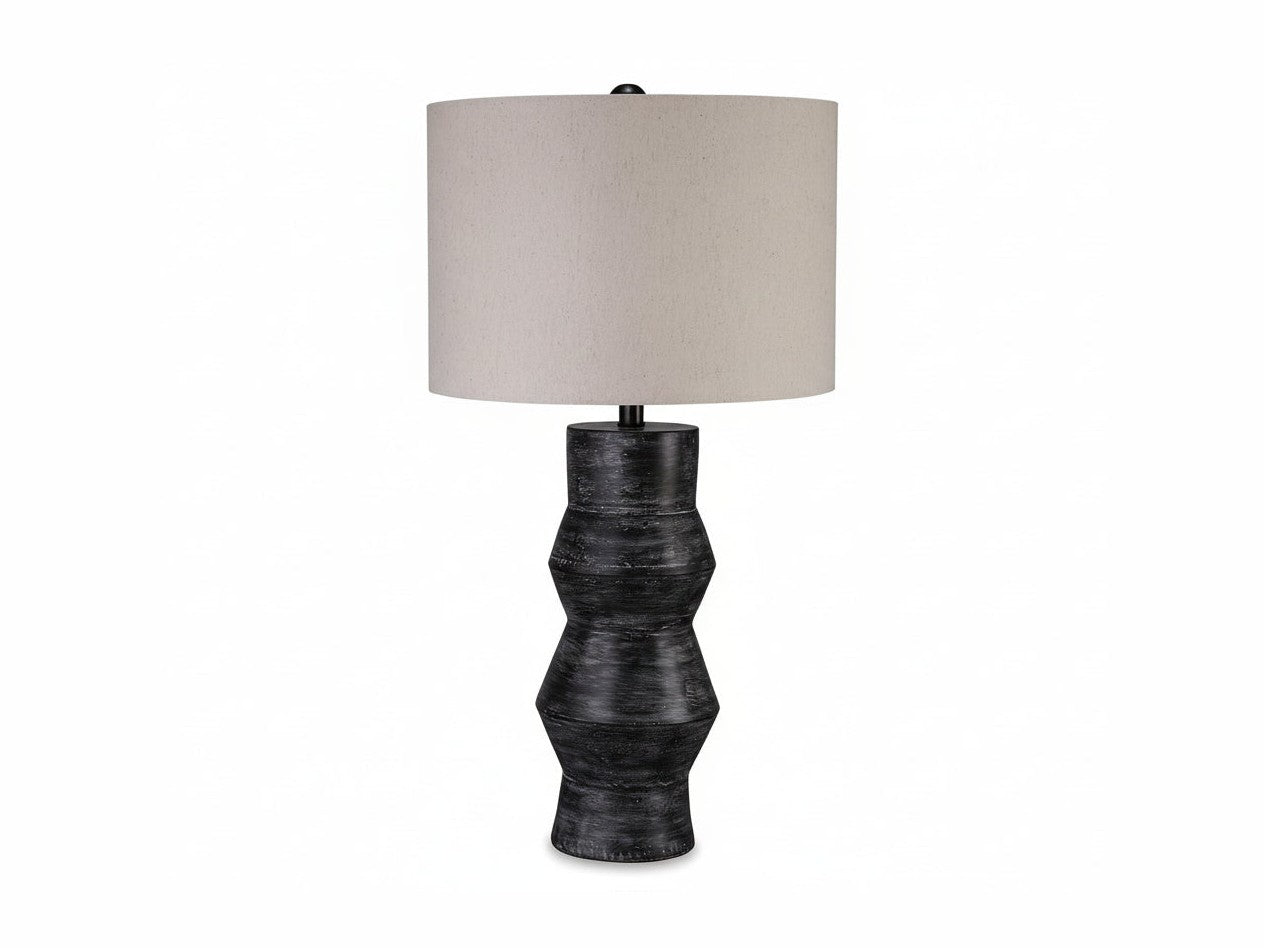 Kerbert table lamp with textured black base and beige lampshade on a white background