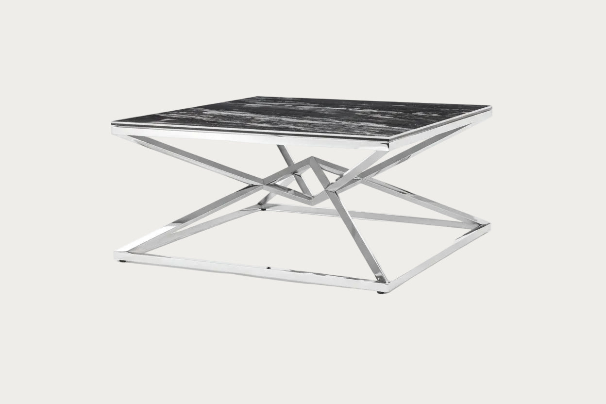 Pyramid modern coffee table with black marble top and chrome base on a white background