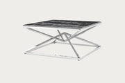 Pyramid modern coffee table with black marble top and chrome base on a white background