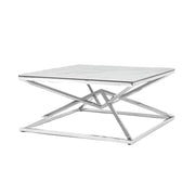A modern square coffee table features a white marble top and a polished chrome geometric base.