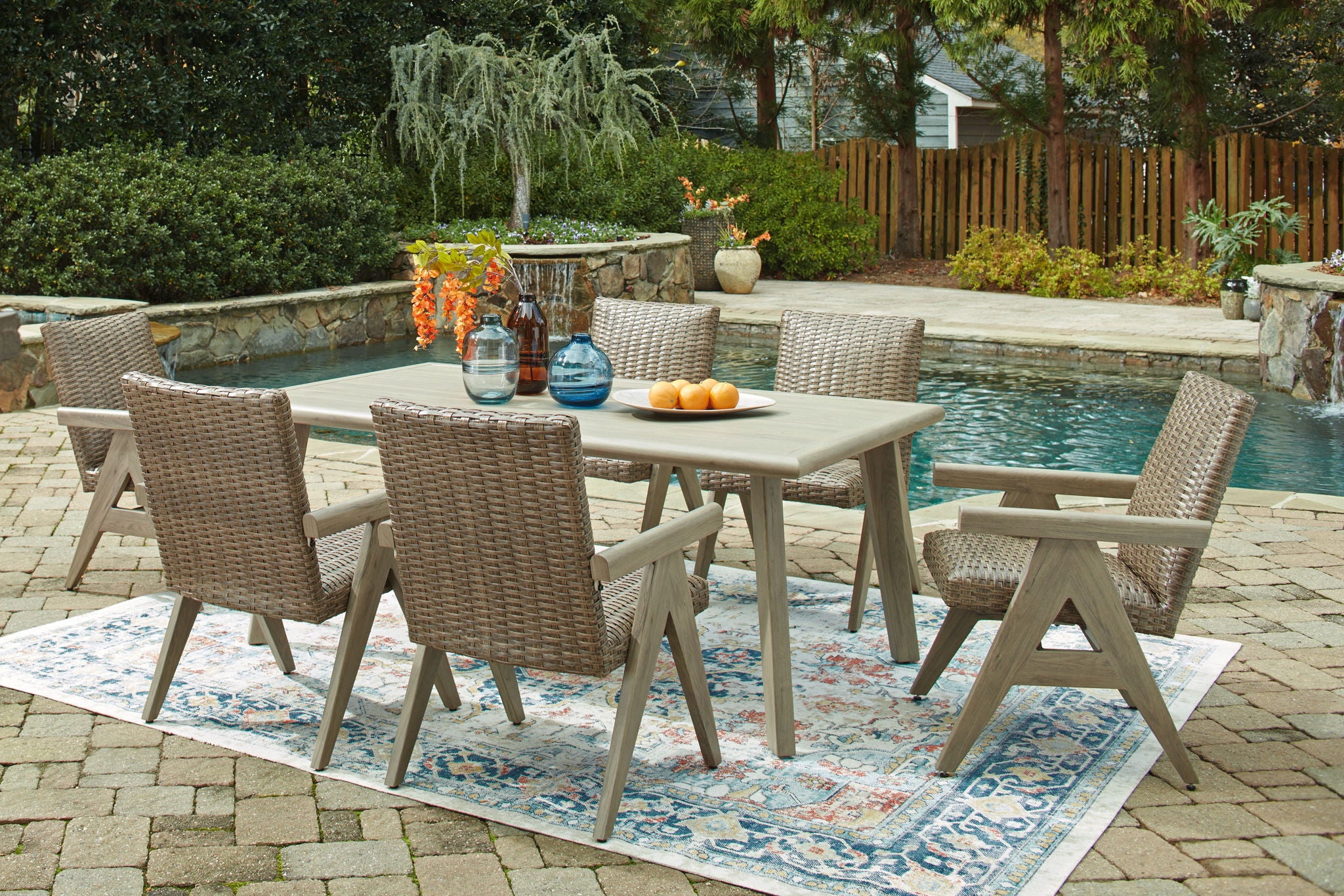 Carisbo - 7 Pc. - Dining Table With Umbrella Option, 4 Arm Chairs, 2 Rocking Arm Chairs - Beige