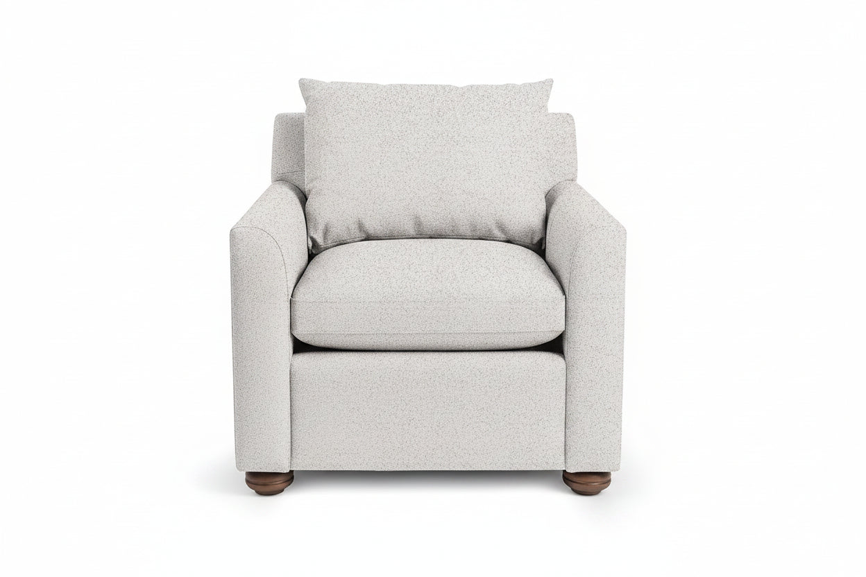 Gray armchair with a pillow on a white background