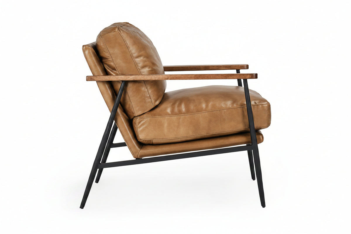 Brown leather armchair with black metal legs on a white background