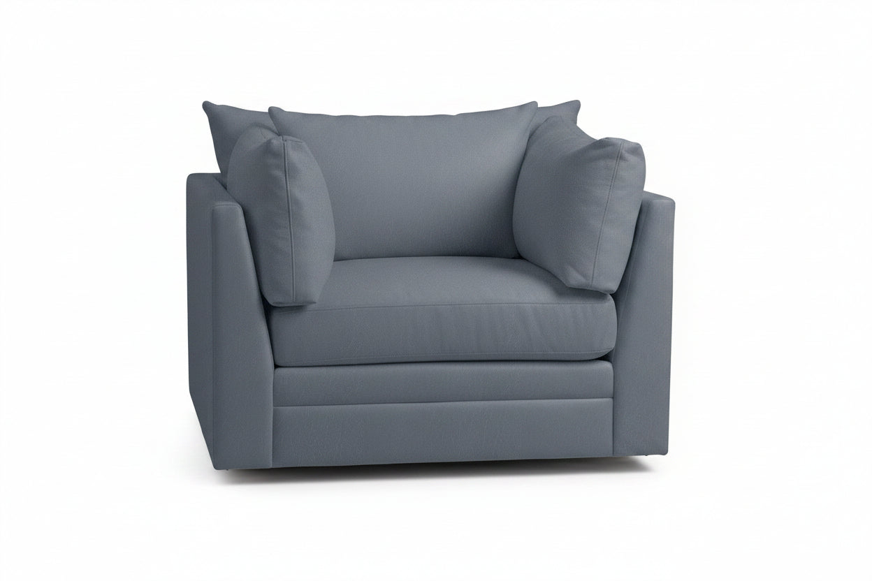 Blue armchair with a pillow on a white background