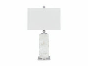Malise table lamp with a white rectangular shade and a textured white base on a white background