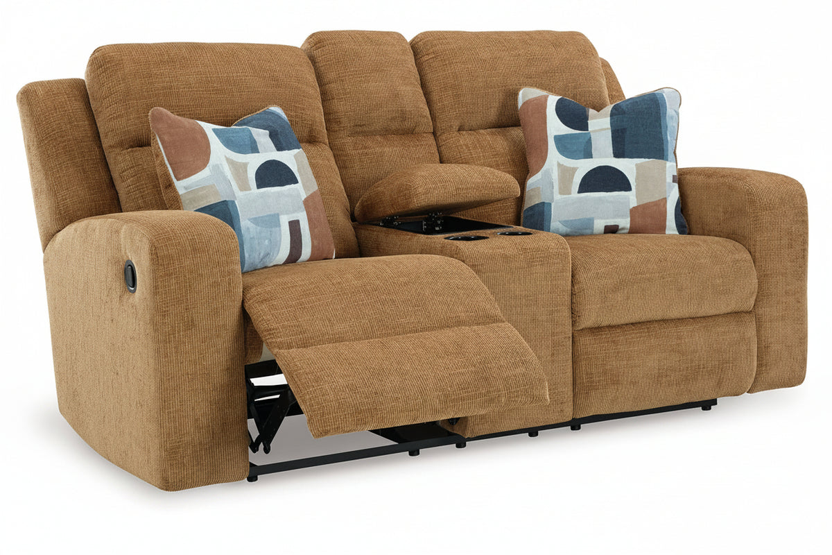 Brown reclining sofa with patterned cushions on a white background