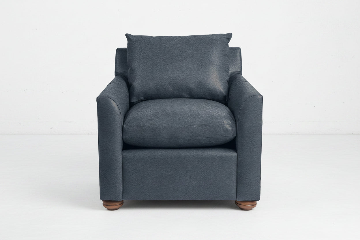 Blue armchair with wooden legs on a white background