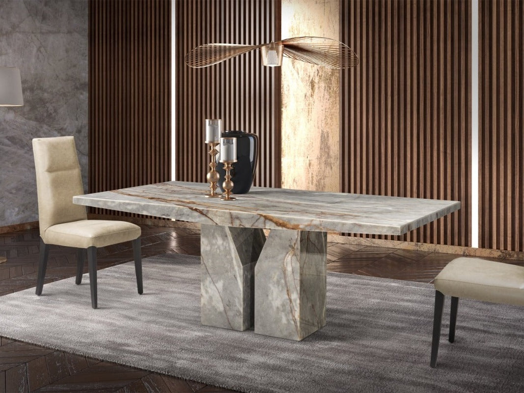 Dining room with a marble table and chairs in a modern interior setting.