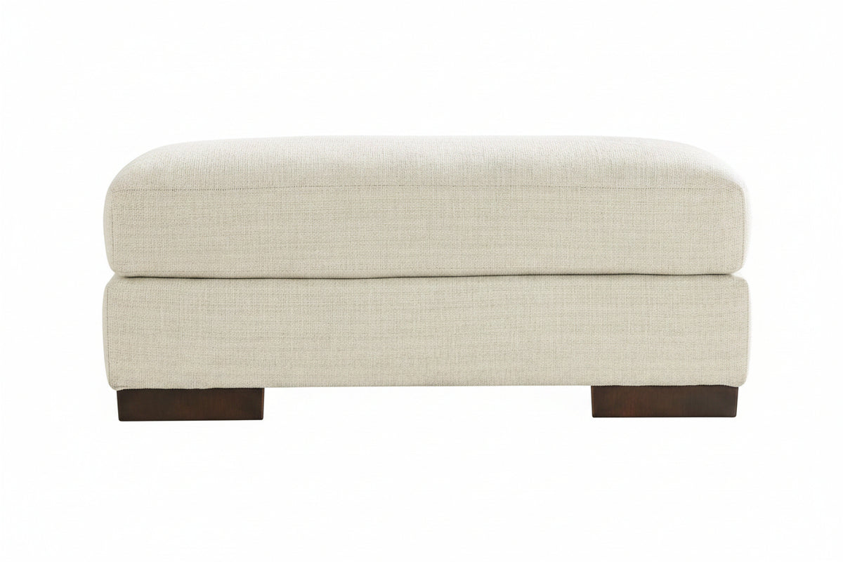 Beige ottoman with brown legs on a white background