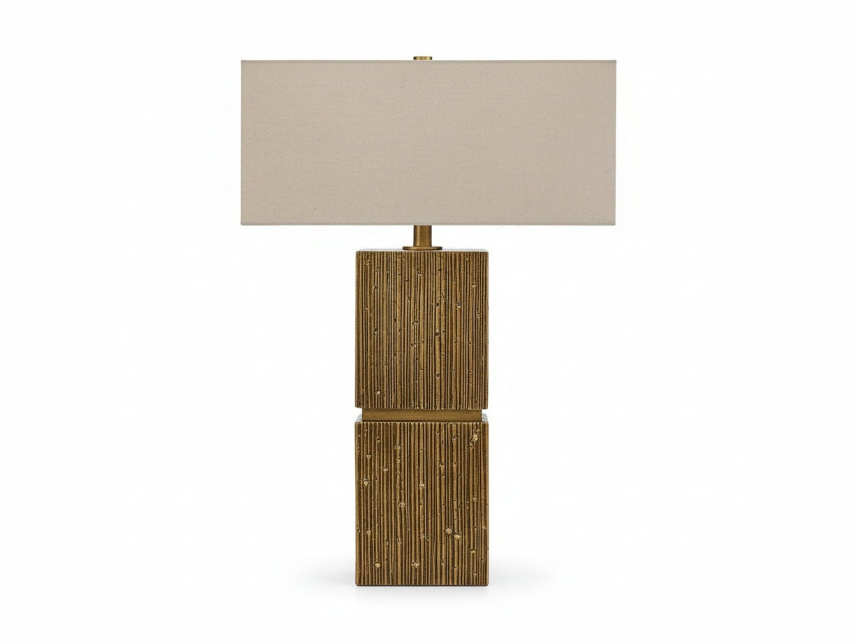 Laddner table lamp with a textured square base and beige rectangular shade on a white background