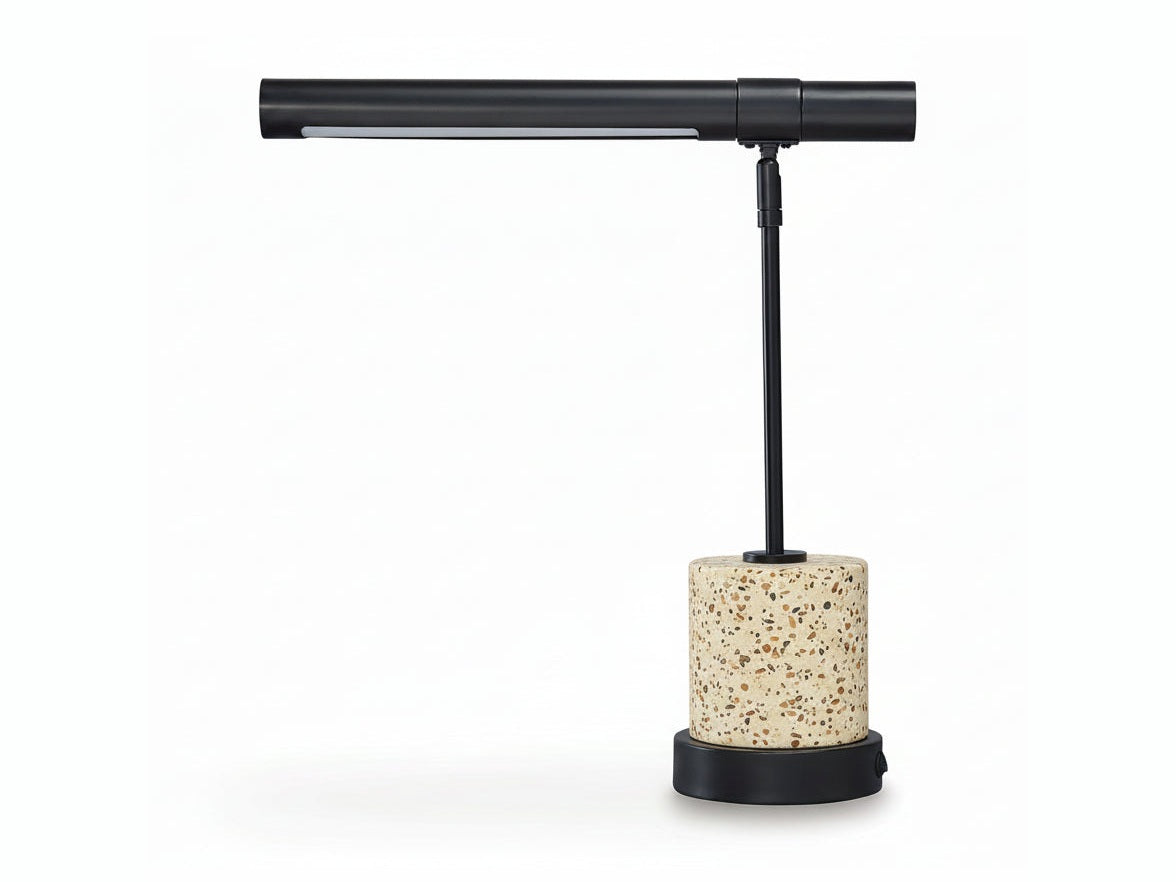 Table lamp with stone base and black adjustable arm on a white background
