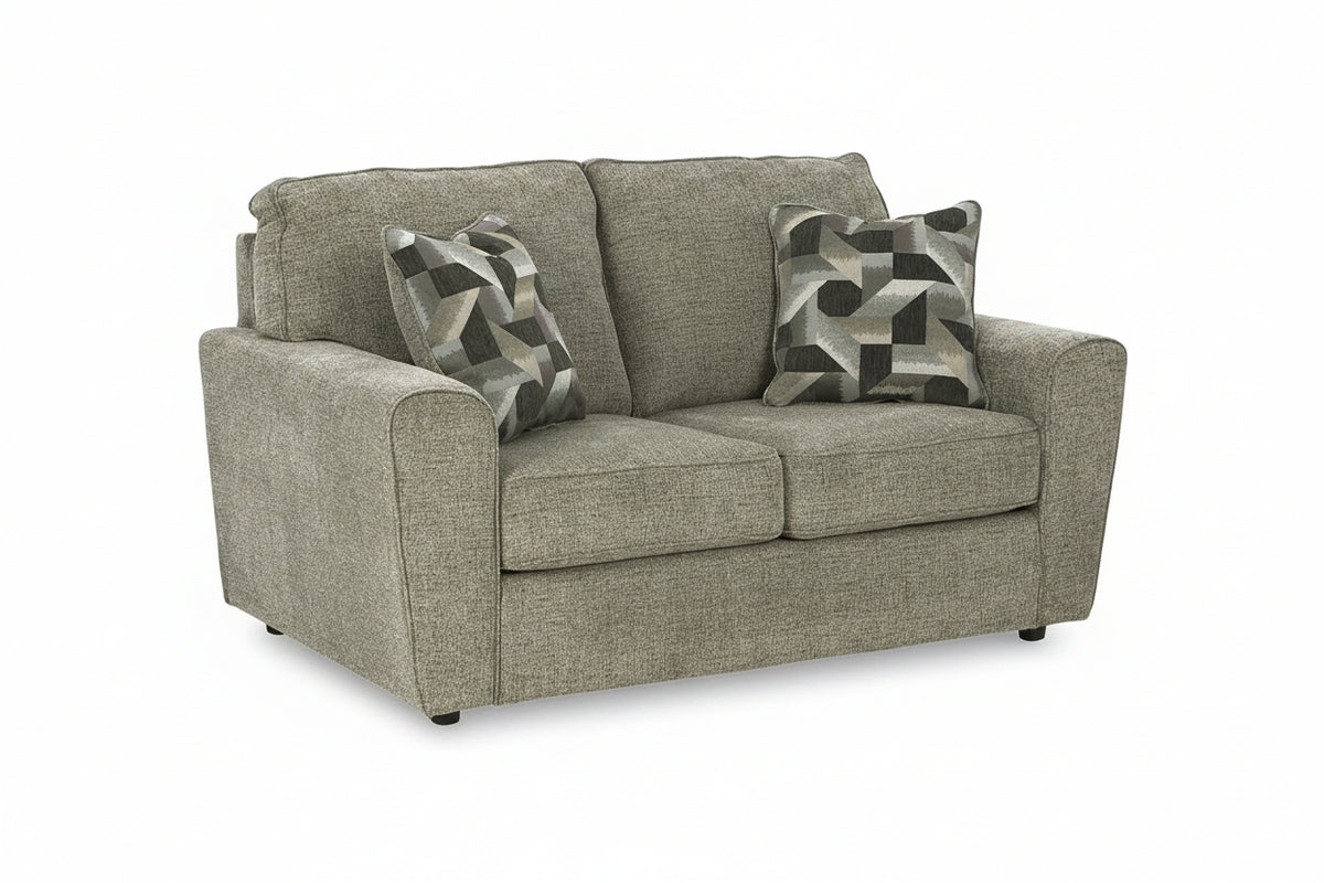 A two-seater loveseat sofa upholstered in textured taupe-gray fabric, featuring two matching throw pillows with a gray, black, and white geometric pattern, shown on a white background.