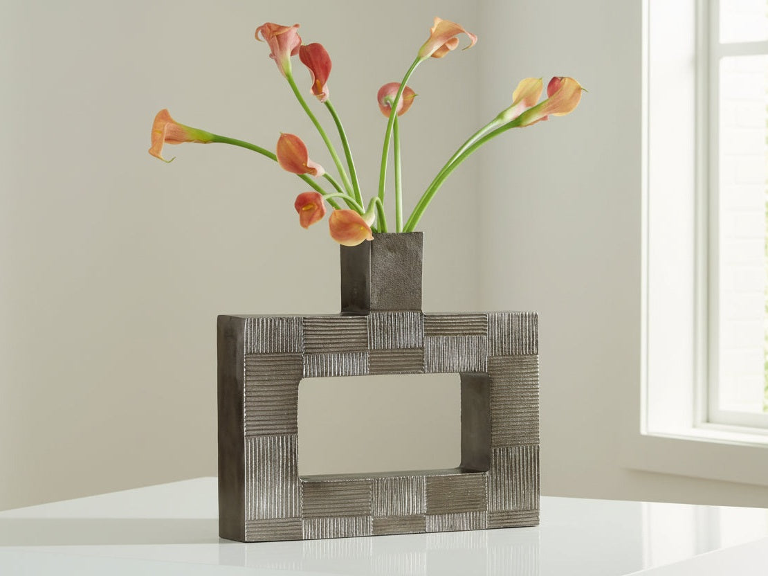 Wrengrove decorative vase with geometric pattern containing flowers on a light background.