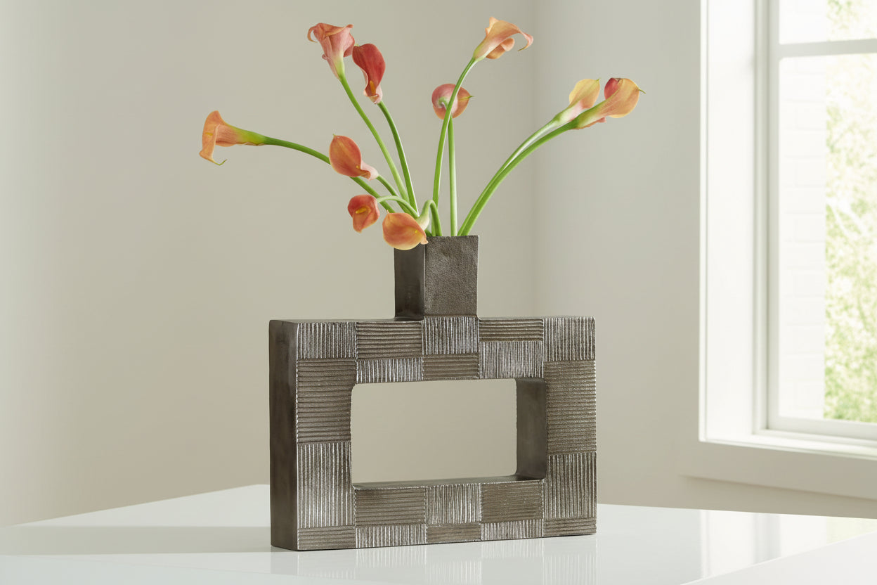 Wrengrove decorative vase with geometric pattern containing flowers on a light background.