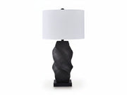 The Amillion table lamp with a black twisted base and white shade on a white background.