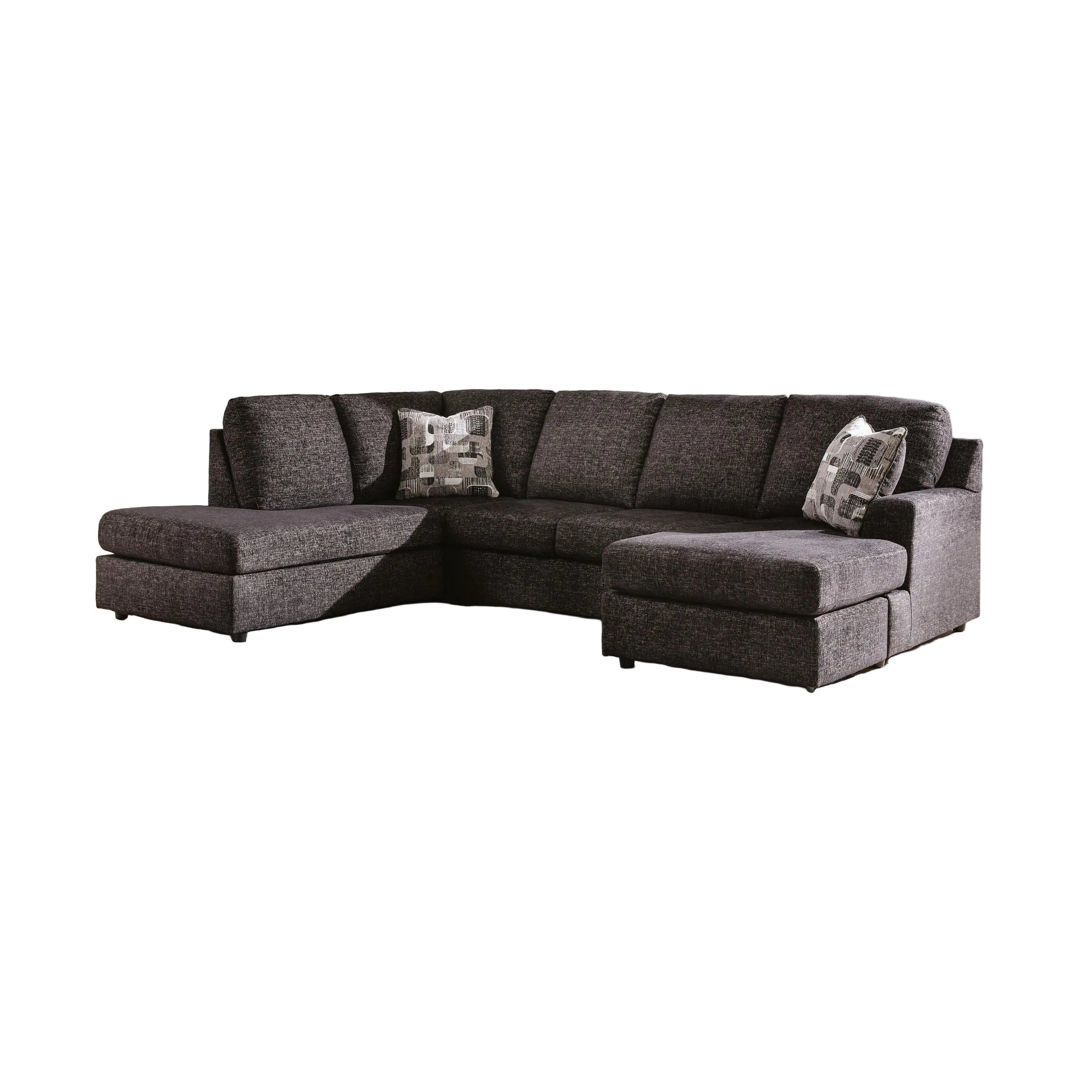 Sectional sofa in a living room with large windows and abstract art on the wall.