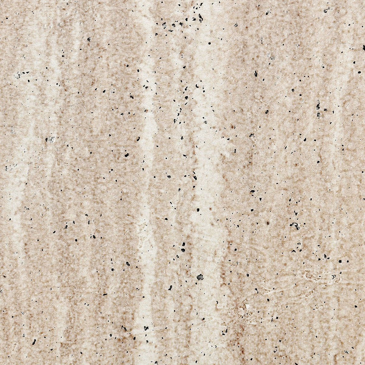A close-up texture of a beige travertine stone tile with natural vertical veining and scattered dark volcanic ash inclusions.