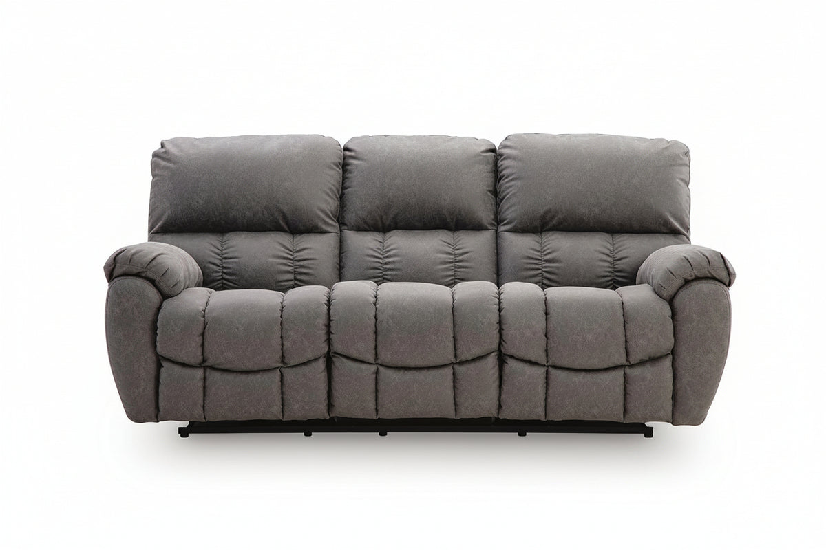 A three-seat gray reclining sofa with plush, generously padded cushions and a tufted quilted design, shown against a plain white background.