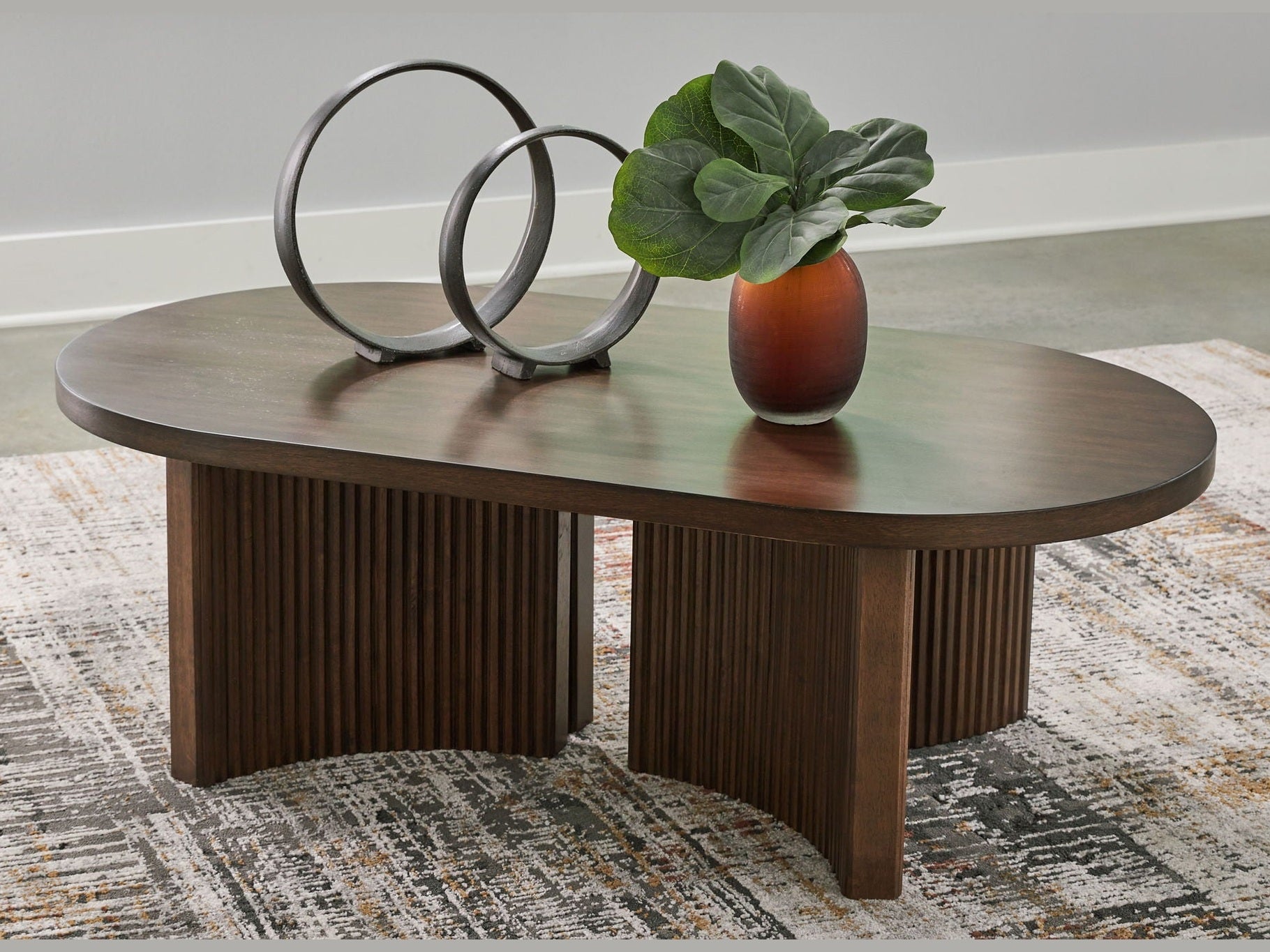 Korestone - Oval Cocktail Table - Dark Brown